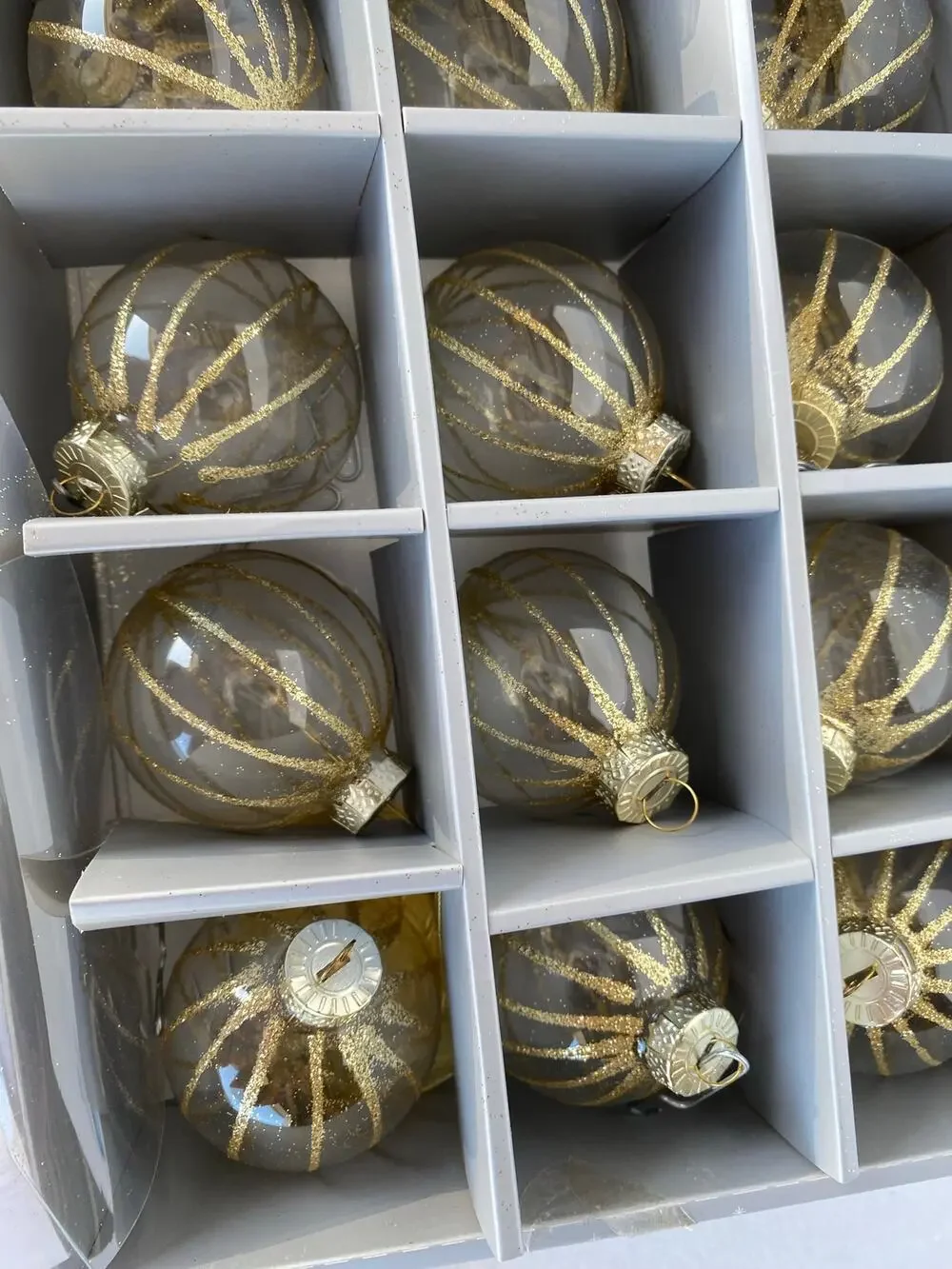 set of 12 glass Christmas ball ornaments featuring a dark tinted or smoked glass